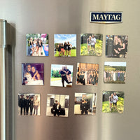 Grid of custom 2×2 photo magnets displayed on a stainless steel refrigerator