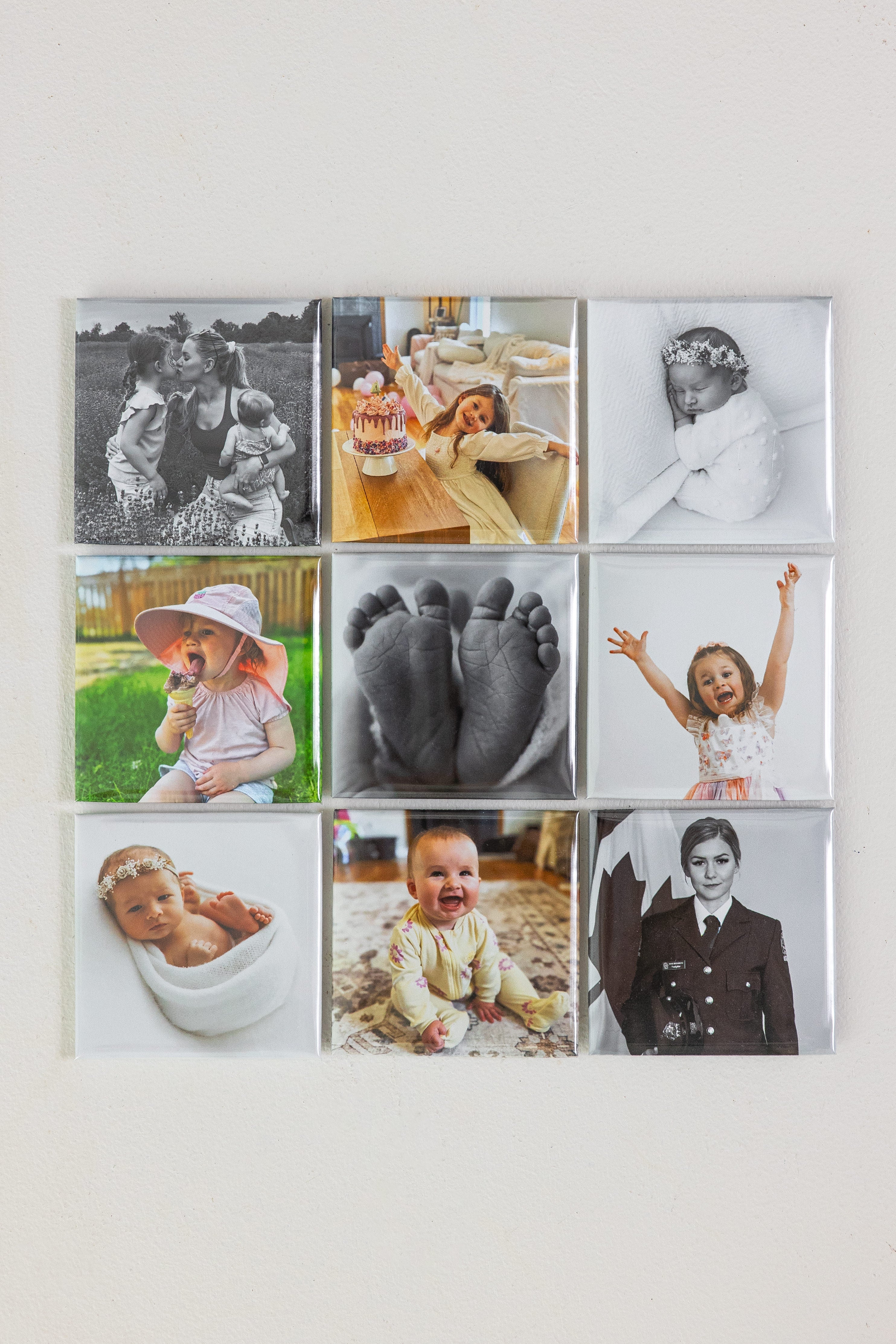 Collage of various photo magnets on a white wall
