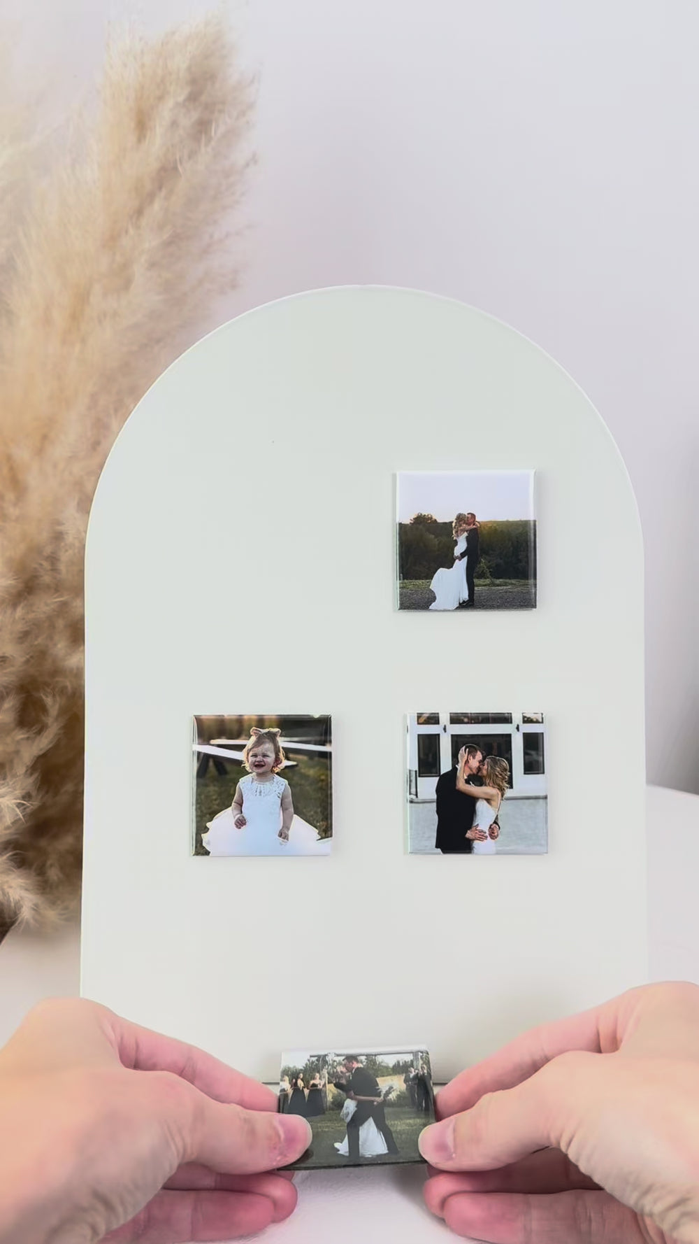 Phone tapping a personalized 2×2 NFC photo magnet to open a linked digital memory